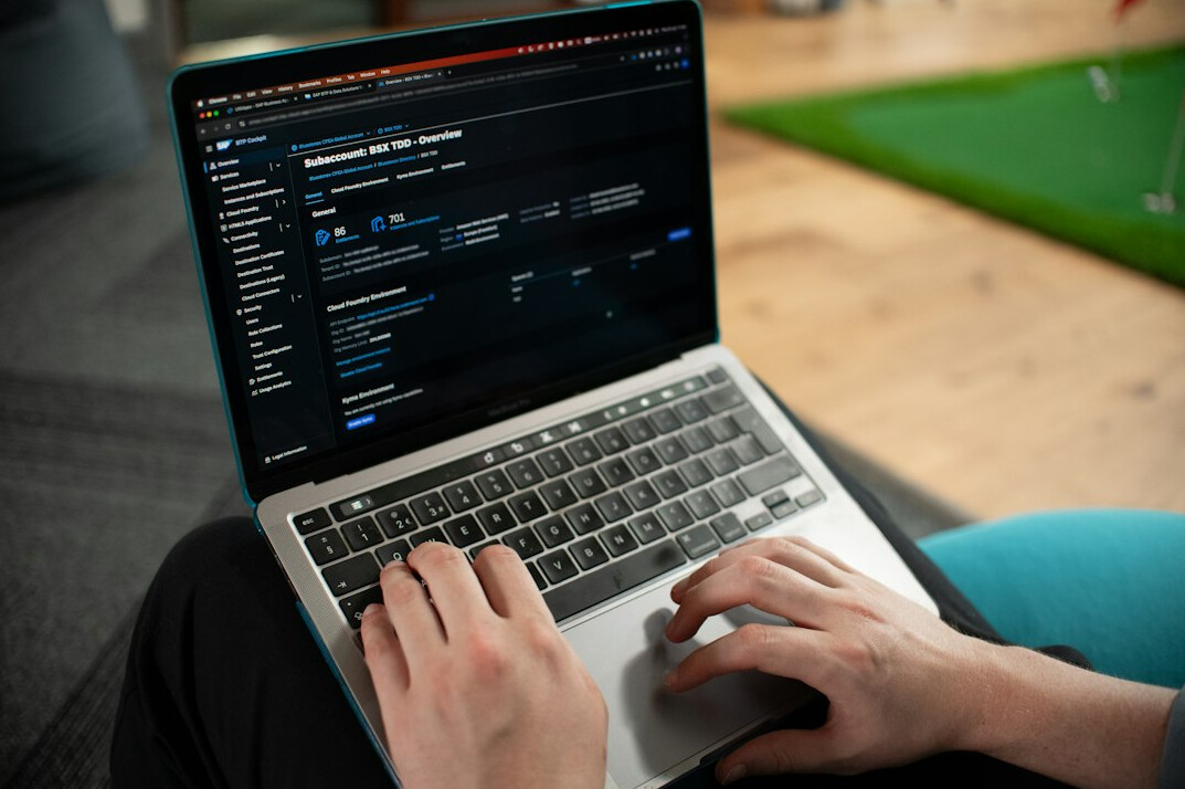 aspiring developer coding on laptop