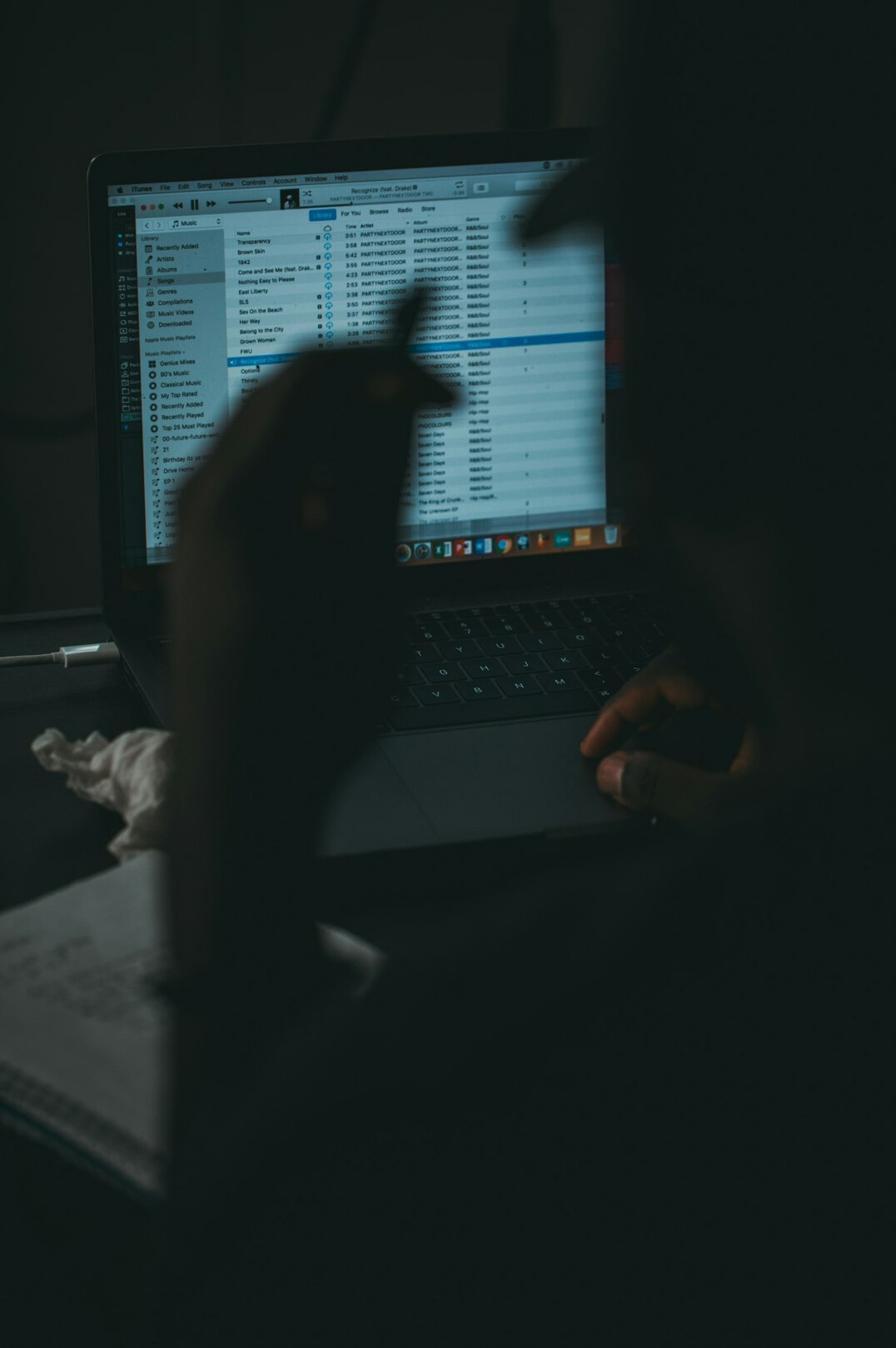 person coding on laptop