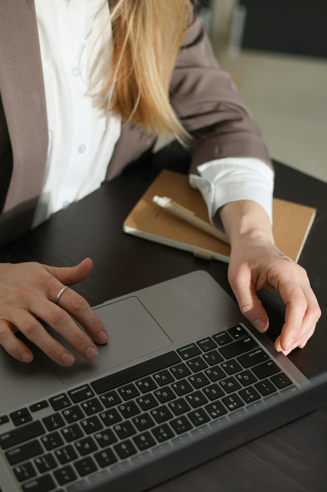 hands typing on keyboard
