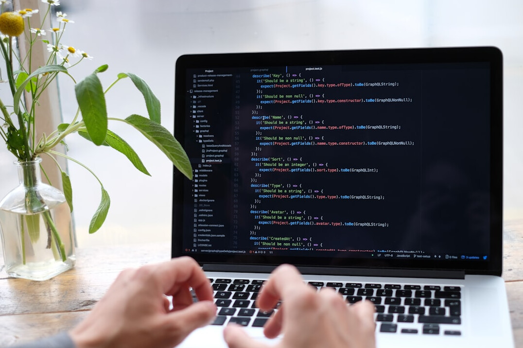 aspiring developer coding on laptop